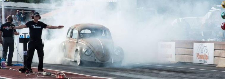 Air-cooled VW Beetle burnout at the drag strip